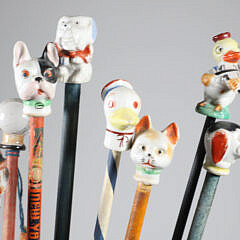Collection of 16 Assorted Porcelain and Wood Carnival Walking Sticks