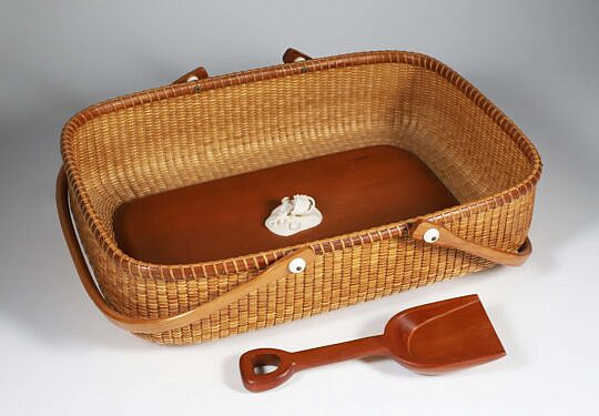 Jean M. Valerio Woven Beach Sand Rectangular Form Nantucket Basket, Circa 2003, double swing handles, shovel and applied sand carving with shells and basket, weaver