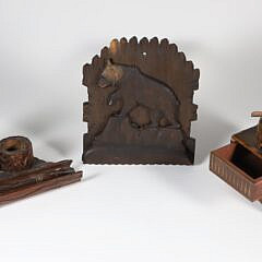 Group of Three Vintage Carved Black Forest Items including: inkwell and pen tray wall pocket music box smoke stand wall pocket