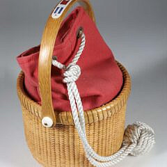 Jean M. Valerio Woven Round Swing Handle Nantucket Basket, Circa 2016, fitted with Nantucket red canvas bag with sailor