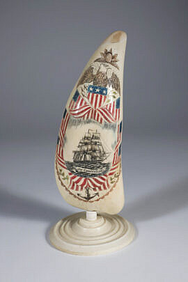 David Lazarus Polychromed Scrimshaw Whale tooth Engraved on Both Sides, "USS Constitution" and "Lady Liberty" on the Reverse on turned whale bone stand 