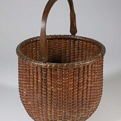 Tall Round Open Swing Handle Nantucket Basket, Early 20th Century, brass ears, carved lollipop handle, incised concentric circles on interior of base