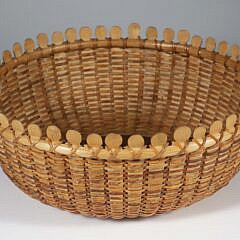 Contemporary Round Nantucket Lollipop Basket, round open form with interior plate having 12 concentric circles, exterior base with branded basket
