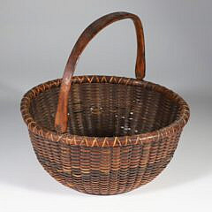 Samuel O. Crawford Rare Baleen Stave Woven Round Open Swing Handle Nantucket Basket with label on base "Made by S.C. Crawford, Nantucket, Mass"
