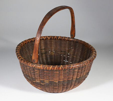 Samuel O. Crawford Rare Baleen Stave Woven Round Open Swing Handle Nantucket Basket with label on base "Made by S.C. Crawford, Nantucket, Mass"