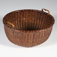 Fine Woven Round Open Nantucket Basket, 19th Century, with carved heart handles and 4 concentric circles in base