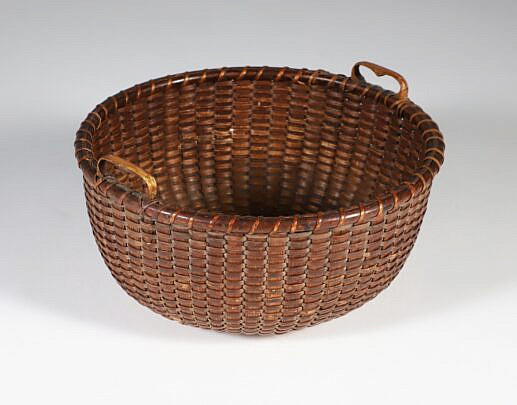 Fine Woven Round Open Nantucket Basket, 19th Century, with carved heart handles and 4 concentric circles in base