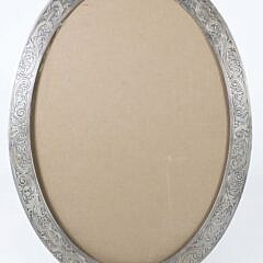 Gorham Sterling Silver Oval Easel Frame, engraved with one inch scrolls, on ball feet