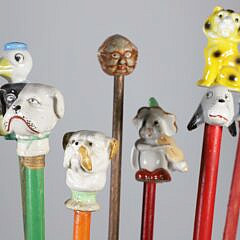 Collection of 16 Assorted Porcelain and Wood Carnival Walking Sticks