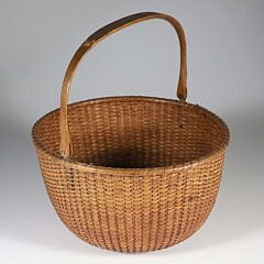 William Appleton Open Round Swing Handle Nantucket Basket, hand written paper label on the base