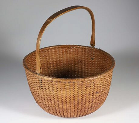 William Appleton Open Round Swing Handle Nantucket Basket, hand written paper label on the base