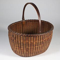 Fine Open Oval Swing Handle Nantucket Basket with Carved Wood Ears, mid 19th Century