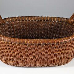 Unusual Vintage Oval Nantucket Basket with Affixed Wrapped Handles