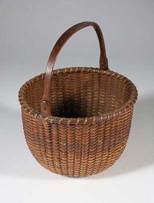 Antique Round Open Swing Handle Nantucket Basket, 19th Century, finely woven with carved wood ears and handle, incised concentric circles on the interior base