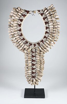 Papua Cowie Shell Bib Necklace on Custom Stand