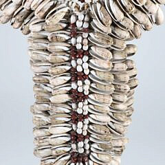 Papua Cowie Shell Bib Necklace on Custom Stand