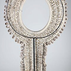 Papua Cowie Shell Bib Necklace on Custom Stand