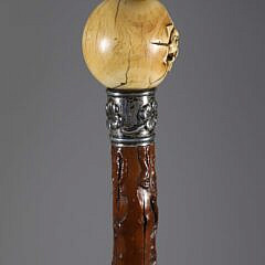 Carved Dog’s Head Emerging From a Ball Walking Stick, 19th Century