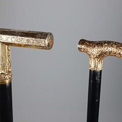 Two Repousse Gold Filled L-Grip Canes, 19th Century