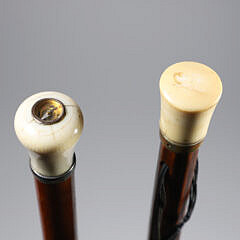 Two Sticks: A Compass Inserted in Grip and Knob Walking Stick on Wood Shafts