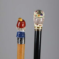 Two Continental Polychrome Porcelain Head Walking Sticks, 19th Century