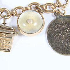 23 Piece Yellow Gold Charm Bracelet