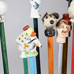 Collection of 14 Porcelain and Wood Carnival Sticks