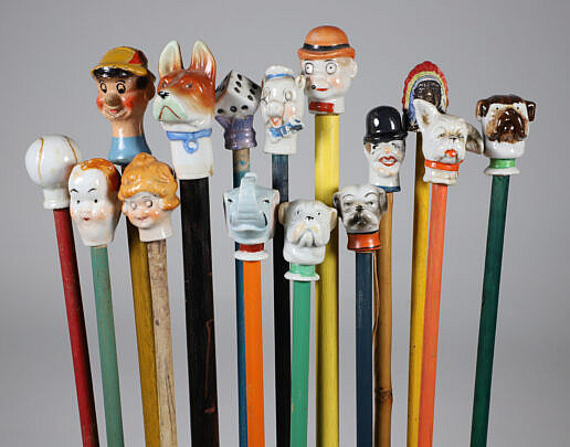 Collection of 15 Porcelain and Wood Carnival Sticks