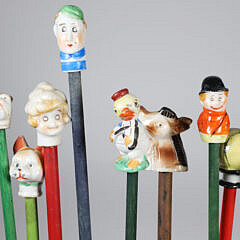 Collection of 15 Porcelain and Wood Carnival Sticks