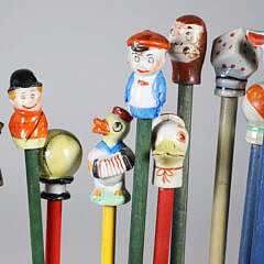 Collection of 15 Porcelain and Wood Carnival Sticks