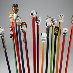 Collection of 15 Porcelain and Wood Carnival Sticks
