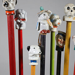 Collection of 15 Porcelain and Wood Carnival Sticks