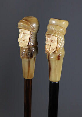 Two Carved Horn and Antique Ivory Face Grip Walking Sticks, 19th Century