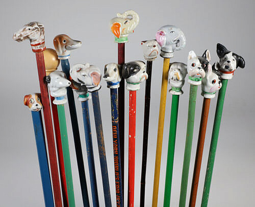 Collection of 16 Assorted Porcelain and Wood Carnival Walking Sticks