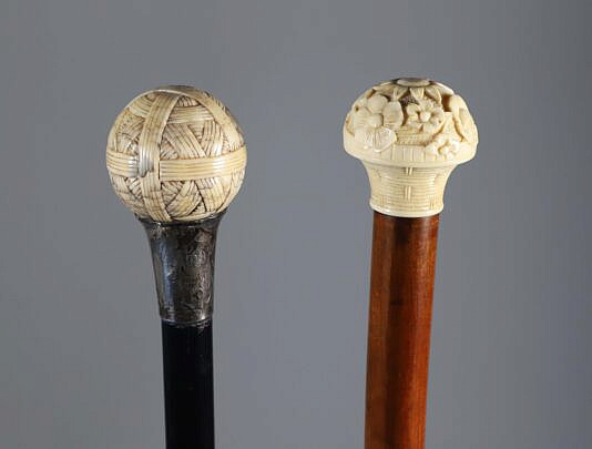 Two Carved Antique Ivory Ball Grip Walking Sticks, 19th Century