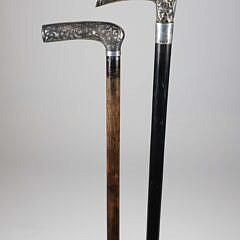 Two Repousse Sterling Silver L-Grip Canes, 19th Century