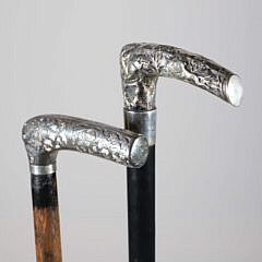 Two Repousse Sterling Silver L-Grip Canes, 19th Century