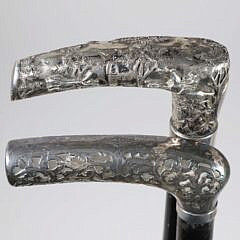 Two Repousse Sterling Silver L-Grip Canes, 19th Century