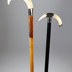 Two Boar’s Tusk C-Grip Canes, 19th Century, with Silver Mounts