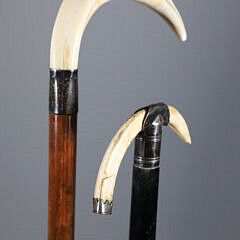 Two Boar’s Tusk C-Grip Canes, 19th Century, with Silver Mounts