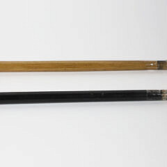 Two Boar’s Tusk C-Grip Canes, 19th Century, with Silver Mounts