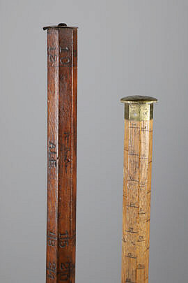 Two Lumberman Measuring Sticks