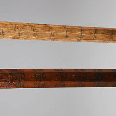 Two Lumberman Measuring Sticks