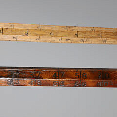 Two Lumberman Measuring Sticks