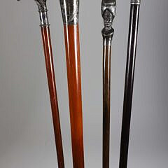 Four Vintage Silvered Metal Grip Walking Sticks