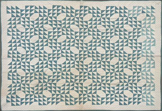 Green and White Flying Geese Quilt