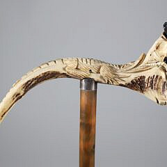 Carved Horn Alligator Tugging on Child