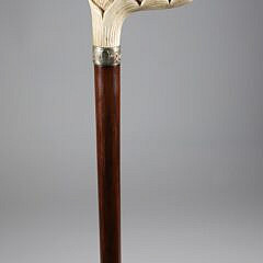 Carved Three Dogs Heads Immerging from a Leaf Grip Cane, 19th Century