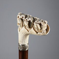 Carved Three Dogs Heads Immerging from a Leaf Grip Cane, 19th Century