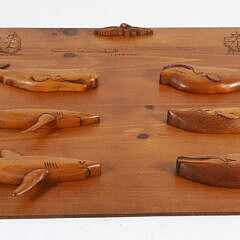 J.Harrop Signed Carved Wood Plaque Depicting Four Whales and Two Shark Half-Bodies Mounted to a Panel